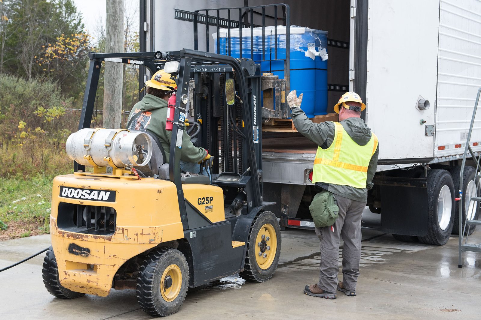Laborer staging material on site
