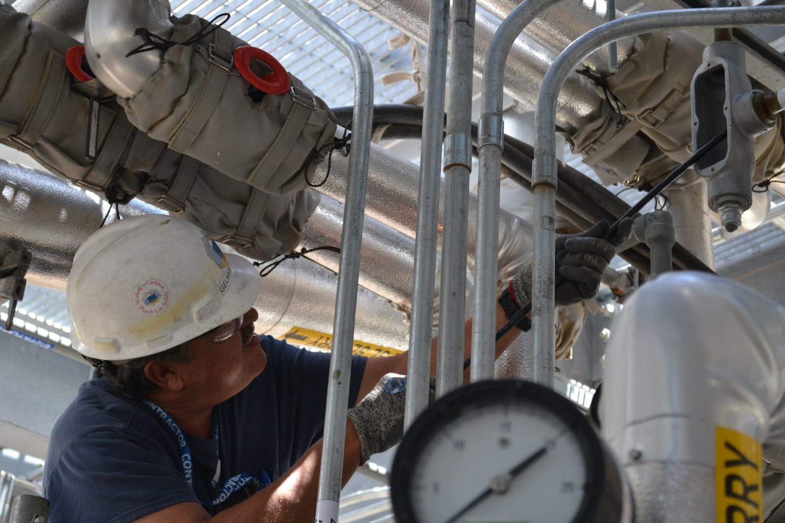 Pipefitter in a mechanical room
