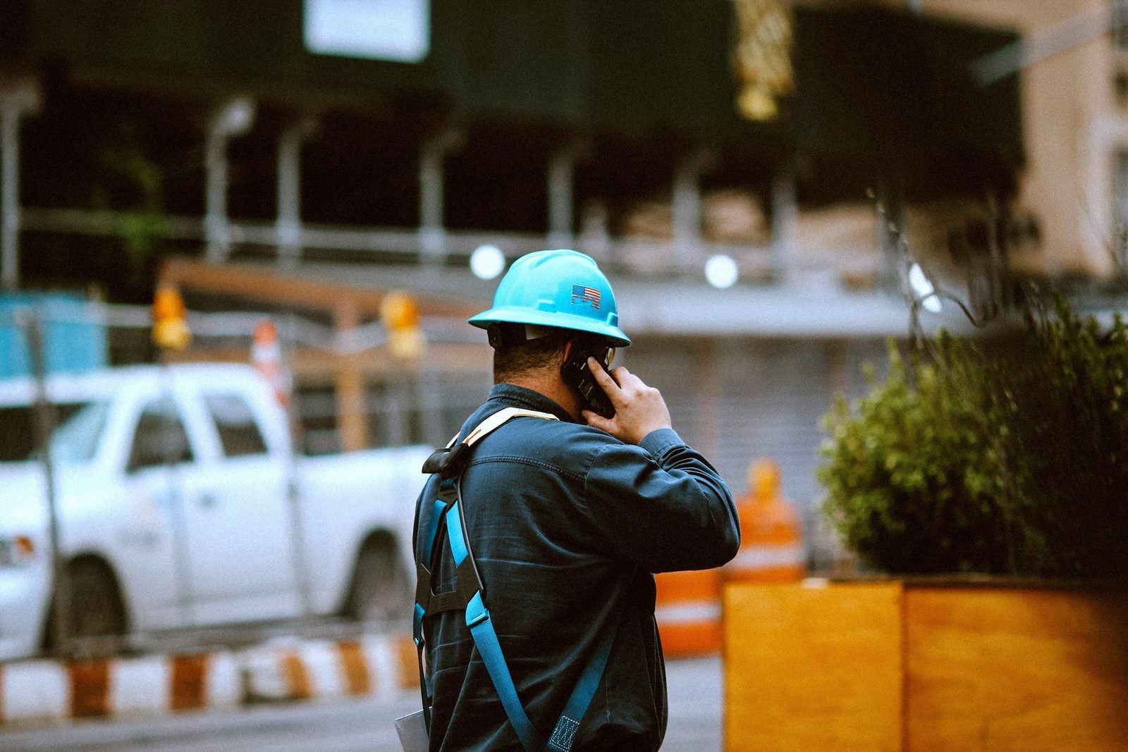 Tradesperson on a call at a job site